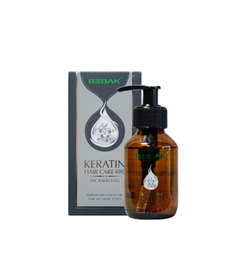100 ml Bebak Keratin Hair Care Oil, perfekt för män, visas elegant framför sin förpackning. Den genomskinliga flaskan avslöjar bärnstensfärgad olja, medan lådan har Golaans signatur droppdesign.